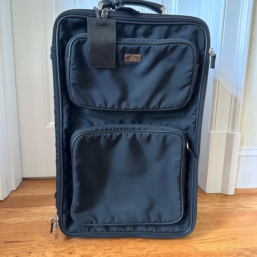 Gucci back pack and rolling luggage travel set